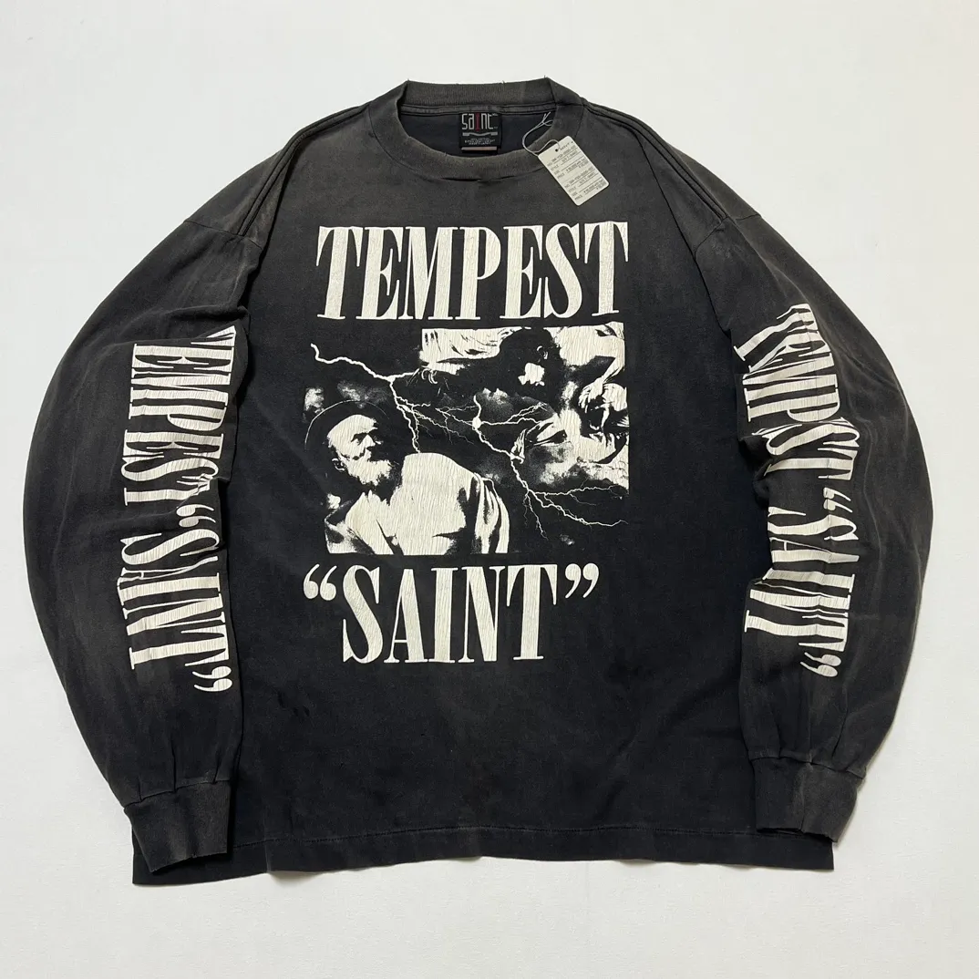 SAINT Mxxxxxx LS TEE/TEMPEST/BLK 'TEMPEST SAINT' Storm Religious Saints Cracked Retro Vulcanized Heavy Wash Long Sleeves Washed Black S-XL Assute Dyeing Multi-bit Horse Fading Craftsmanship Grinding and Hanging Holes Full of Old Feeling Top Printing Craftsmanship Purchasing Level
